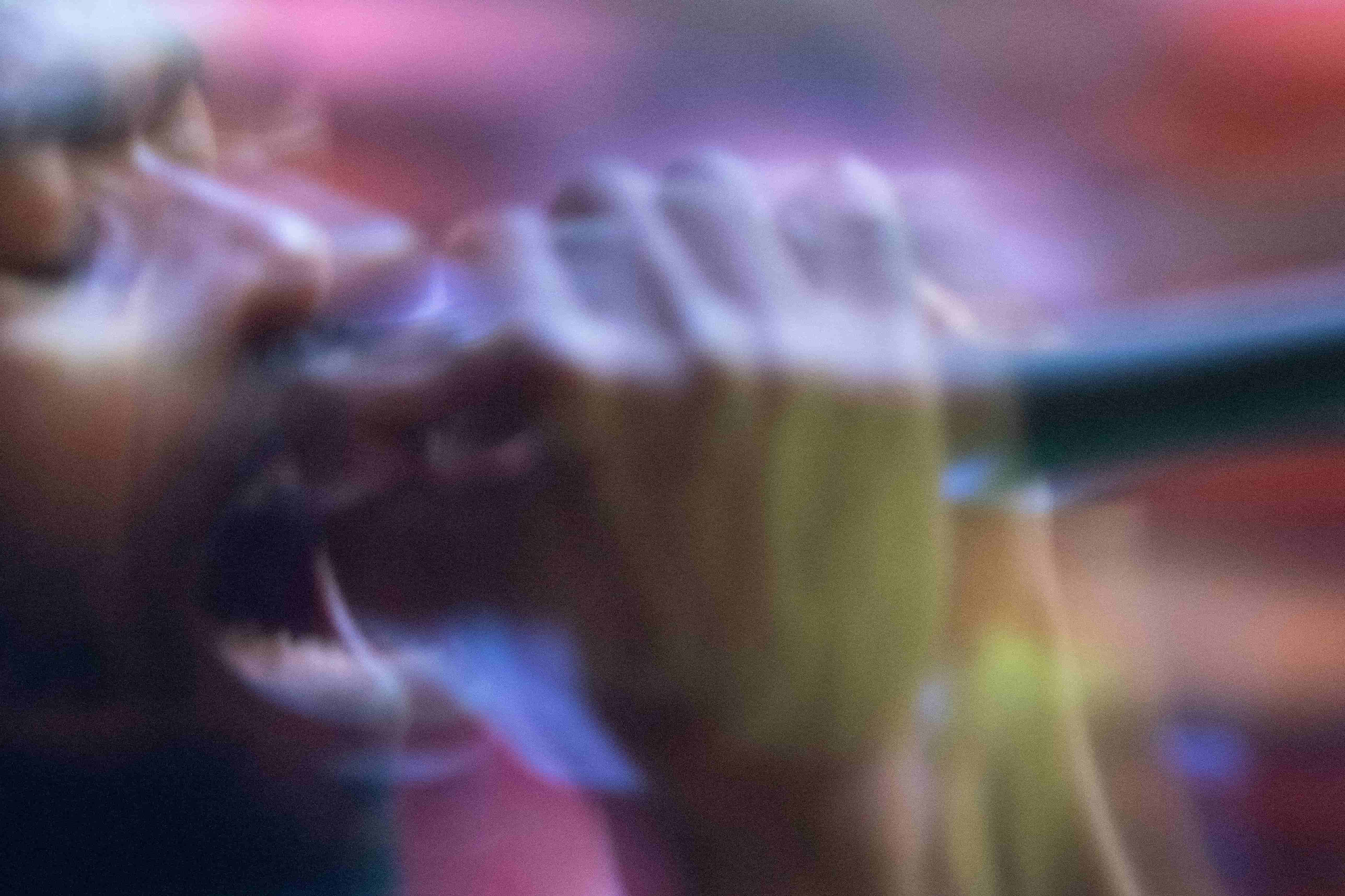 Abstract blurred close-up portrait in purple and gold