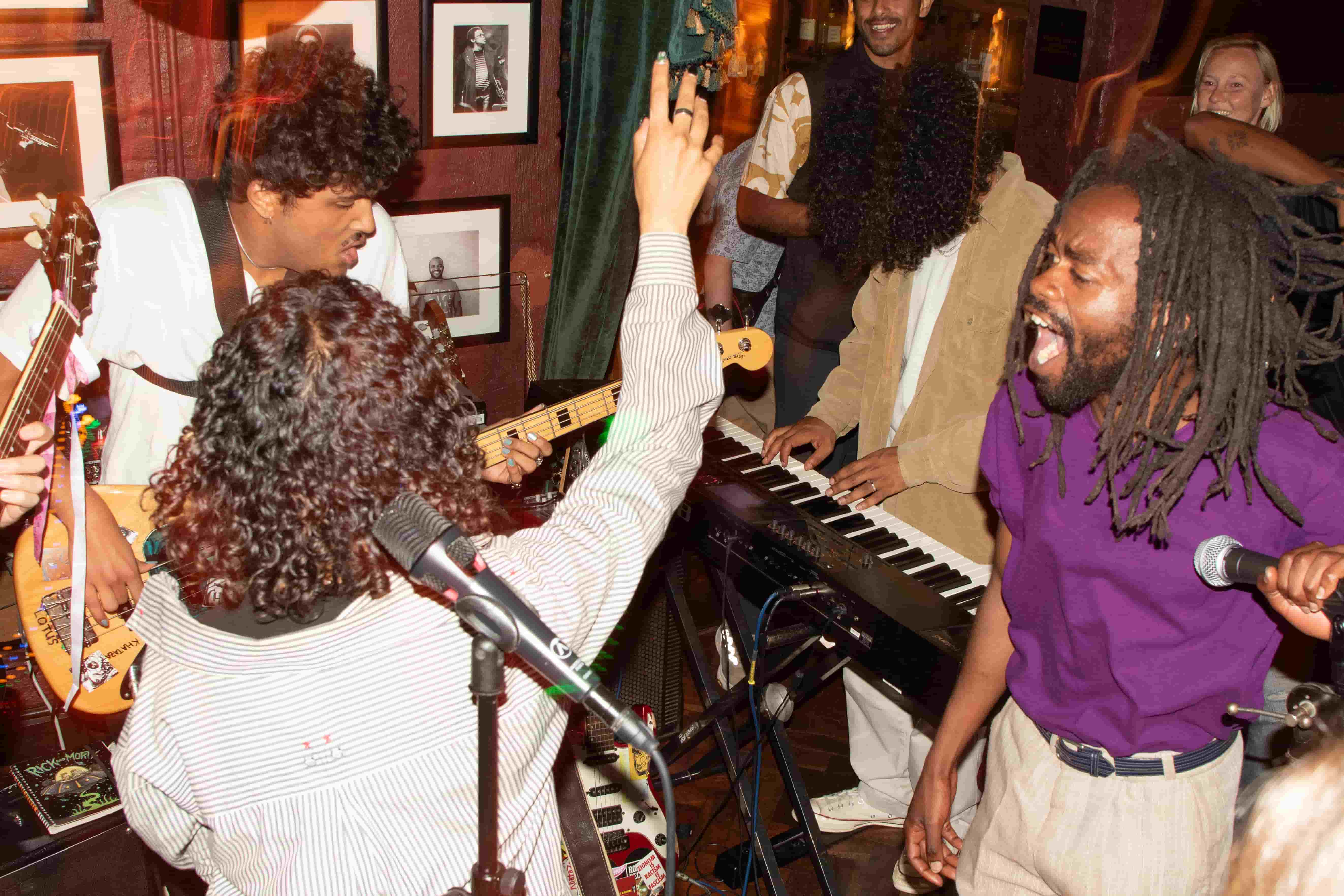 Band playing in intimate venue, warm tones