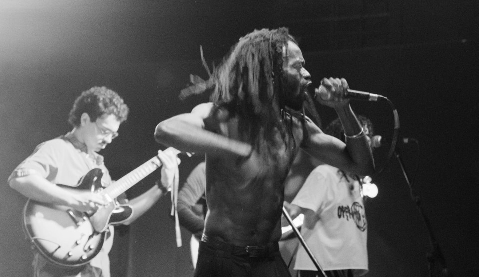 Operation Khataza live — three vocalists at microphones